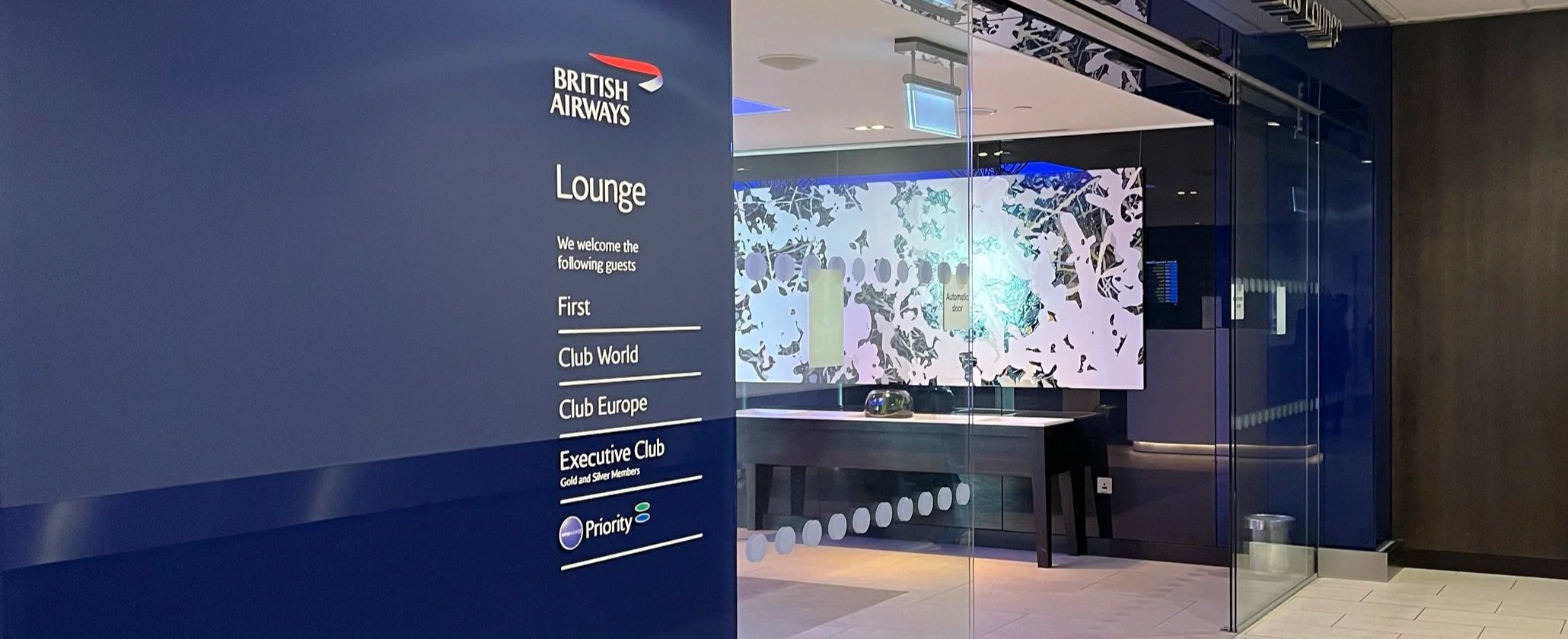 British Airways lounge entrance listing First, Club World, and Club Europe