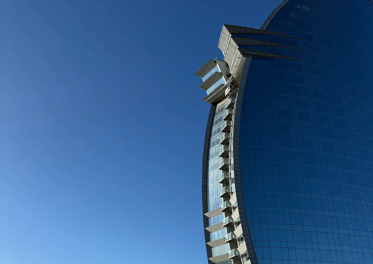 W Barcelona sail-shaped glass tower against a clear sky