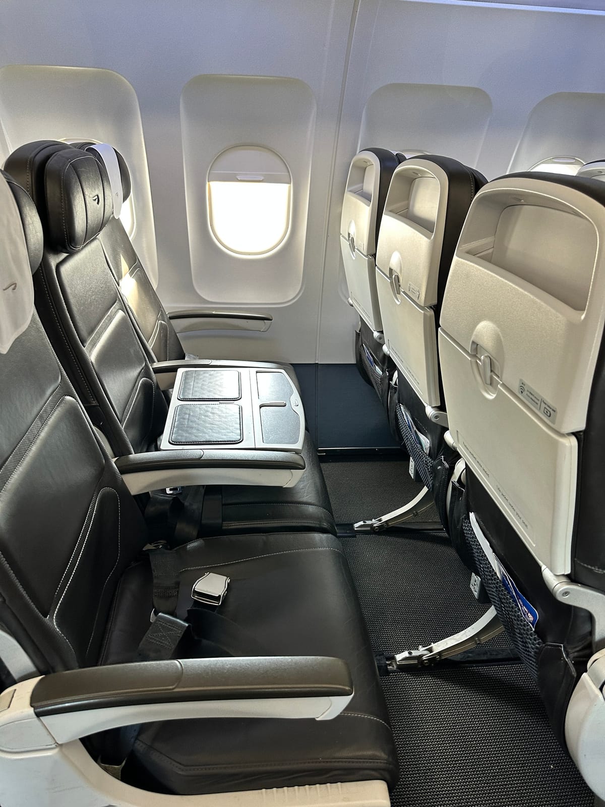 Club Europe window seat with a table over the blocked middle seat