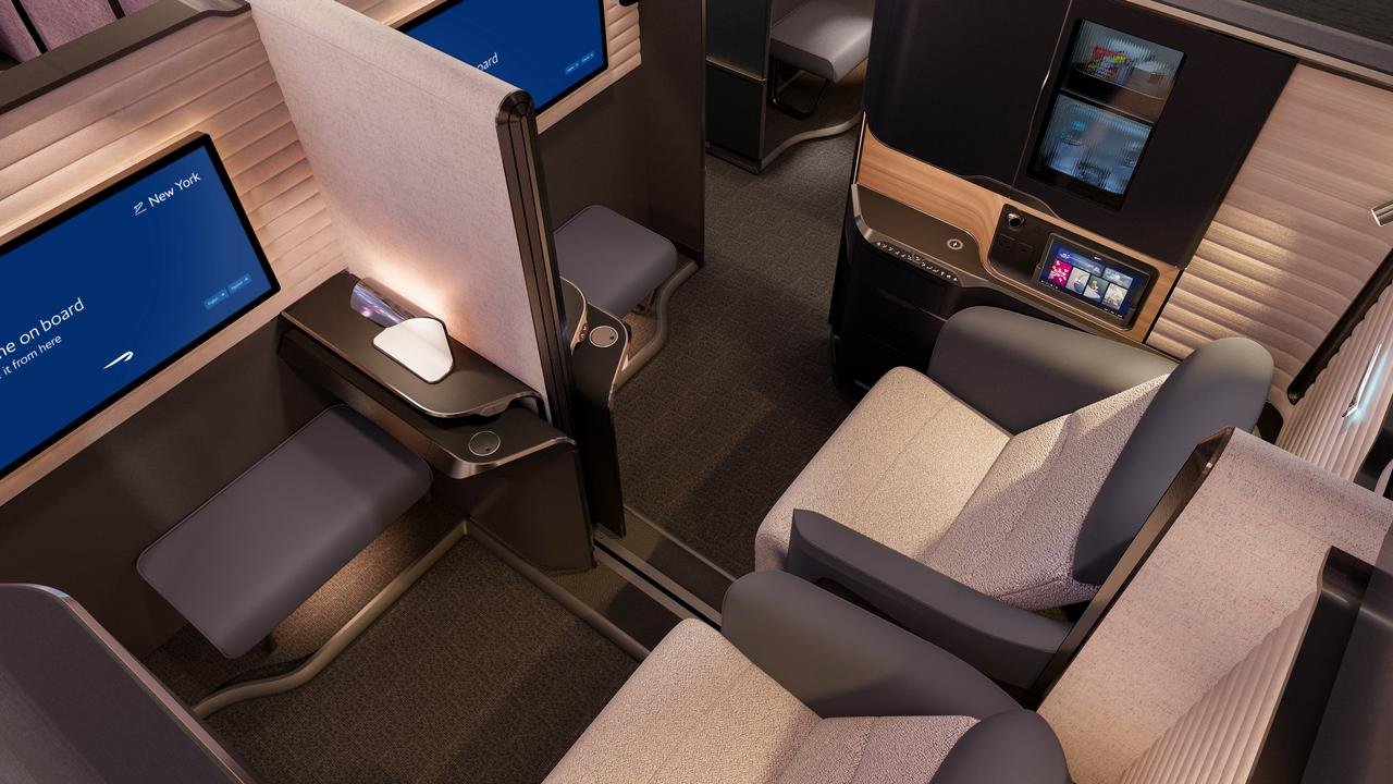 Overhead view of paired British Airways first class seats and screens