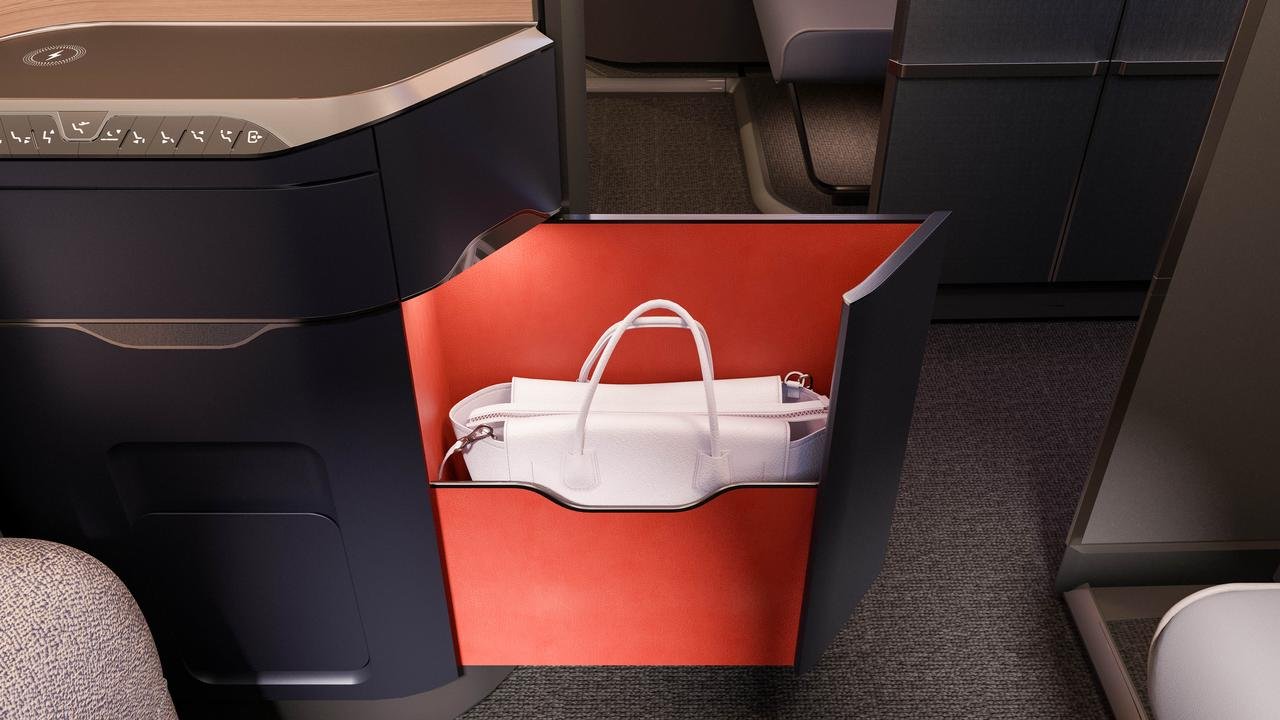 Open British Airways suite drawer with a white handbag inside